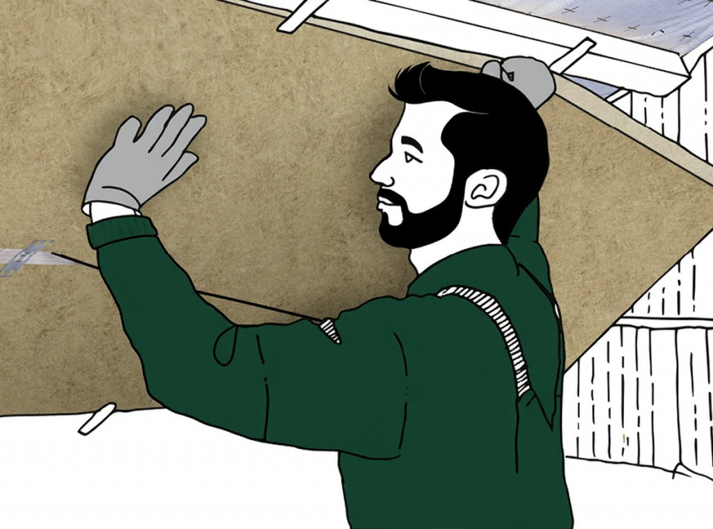 Mann bringt eine Untersparrendämmung mit Mineralwolle an | Der Dämmstoff